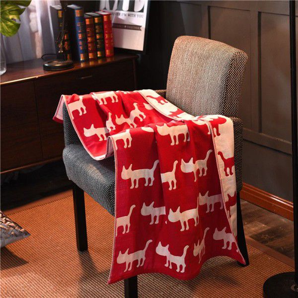 Three layer gauze bath towel with a dark background of red